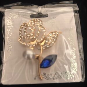 Rose rhinestone blue pedal brooch in gold tone